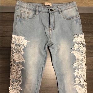 Blue jean pants with white lace